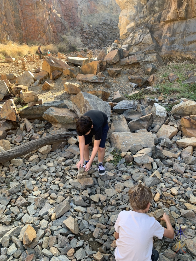 11yo and 8yo make rock balance sculptures