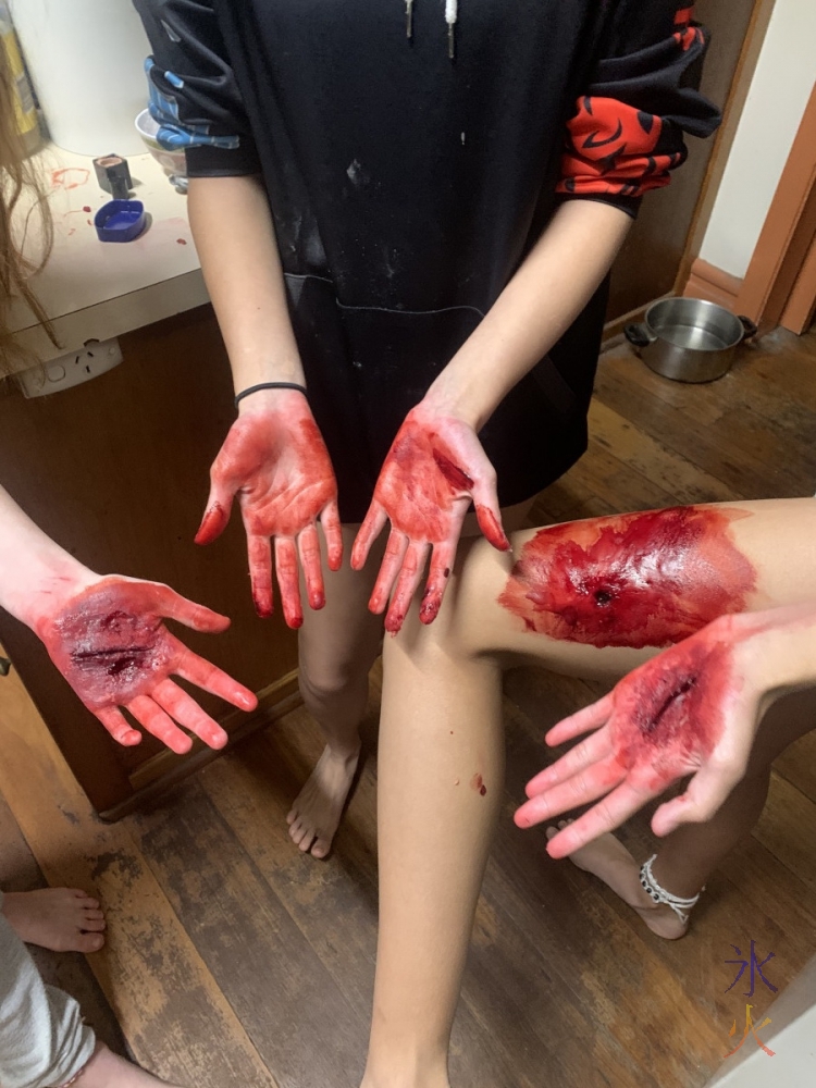 all the fake wounds together and 13yo's 'bloodied' (red food colouring stained) hands