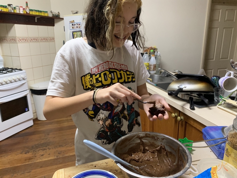 13yo putting frosting on cake shapes