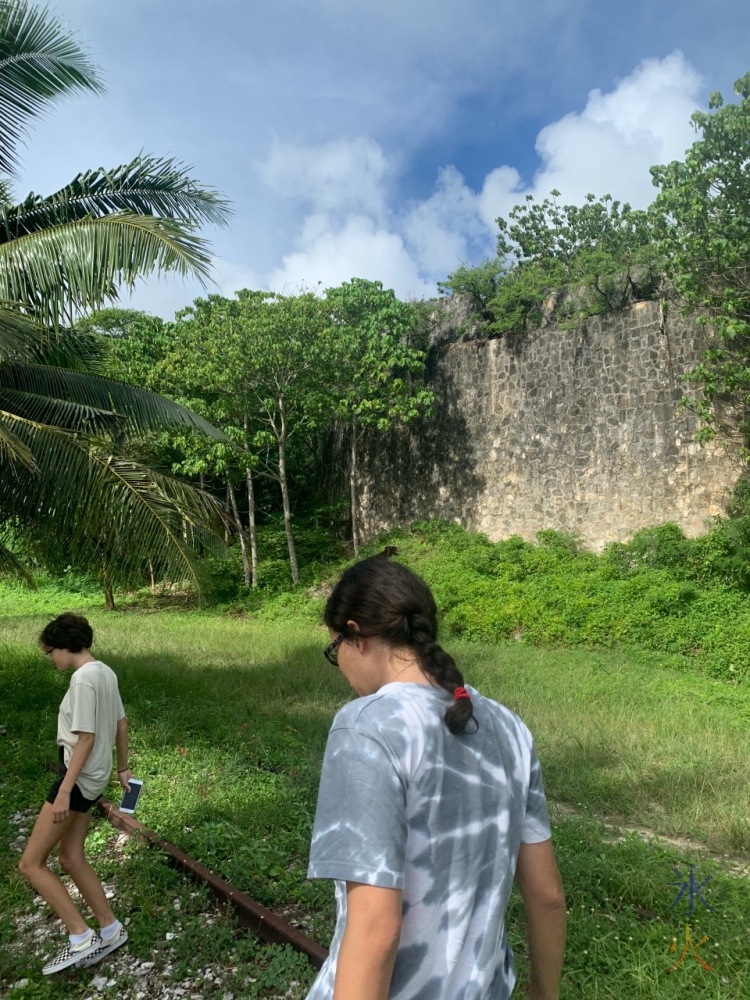 wall and remnants of railway track at South Point Village ruins, Christmas Island