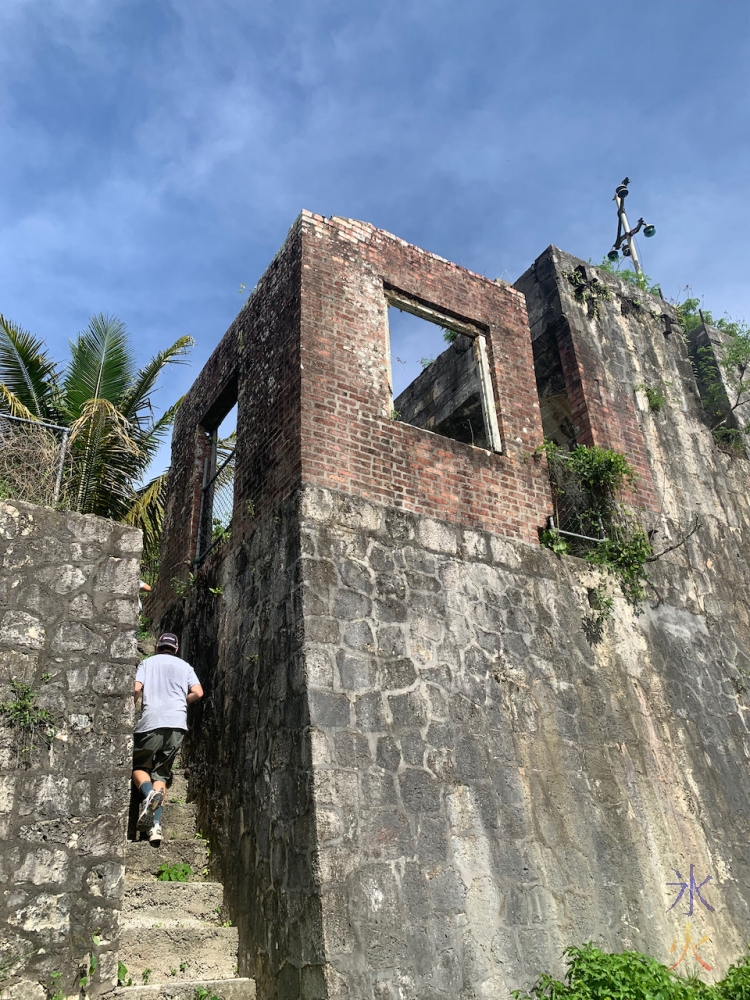 going up the stairs to the train station at South Point Village ruins, Christmas Island