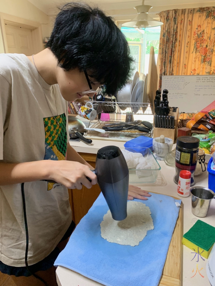 hand-made-paper-being-dried-with-hairdryer