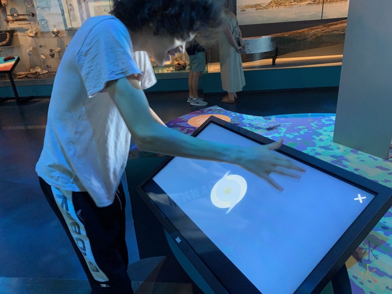 16yo making a cyclone on interactive display in Boola Bardip Museum, Perth, Western Australia