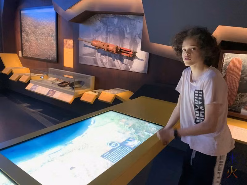 16yo looking at interactive mining map in Boola Bardip Museum, Perth, Western Australia