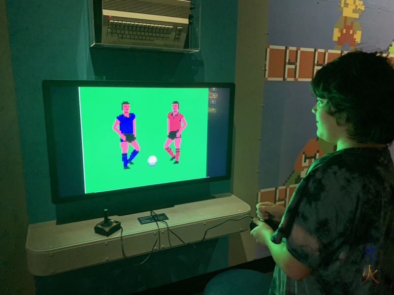 12yo playing really old soccer game at Boola Bardip Museum, Perth, Western Australia