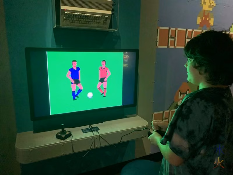 12yo playing really old soccer game at Boola Bardip Museum, Perth, Western Australia