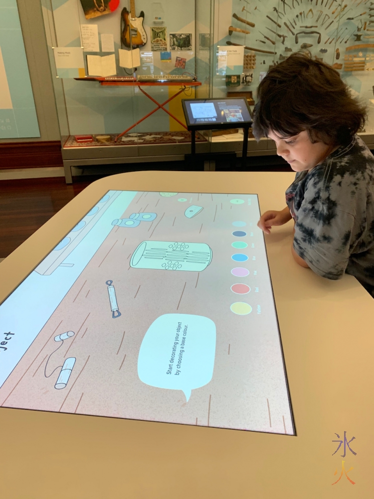 12yo playing with pottery interacvtive display at Boola Bardip Museum, Perth, Western Australia