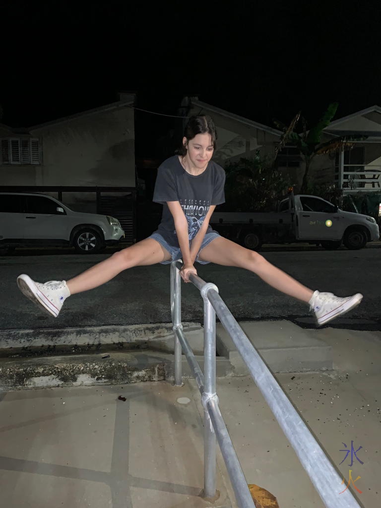 17yo doing her signature straddle hold on a stair rail on Christmas Island