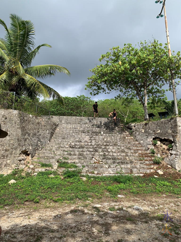 Boys at the top of the stairs at South Point Ruins, Christmas Island