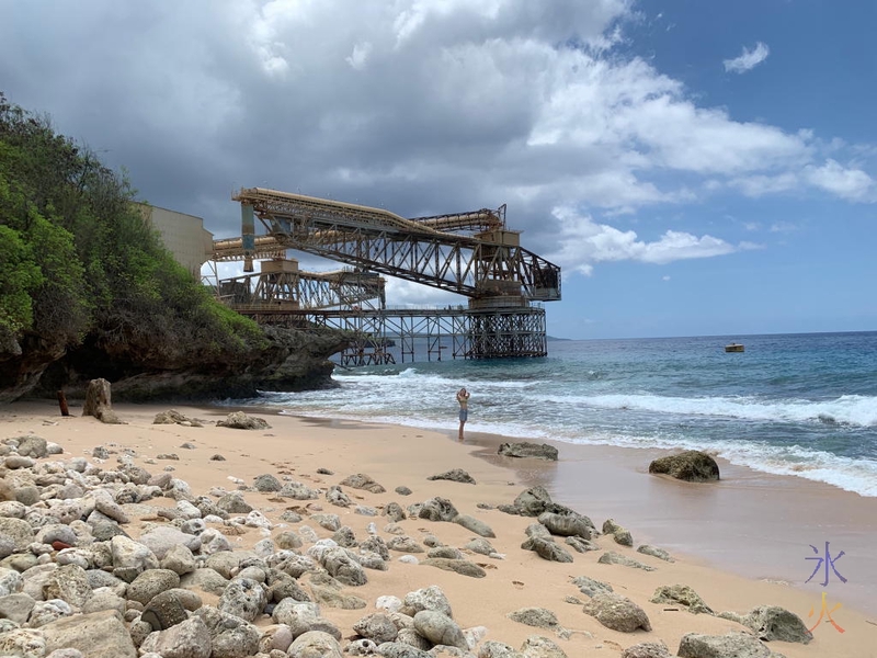 A small rocky beach with a very steep dropoff on the other side of the cantilevers on Christmas Island