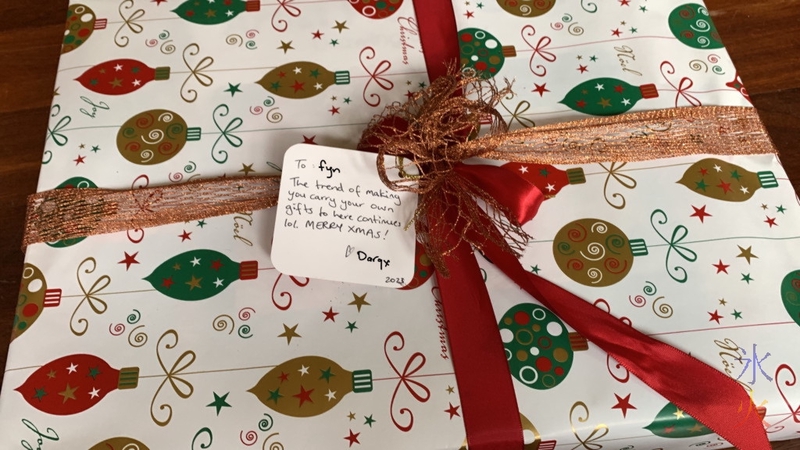 a pretty Christmas box tied with red ribbons