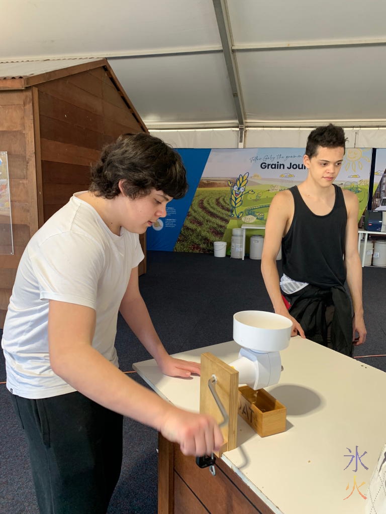 15yo grinding grains at the Perth Royal Show