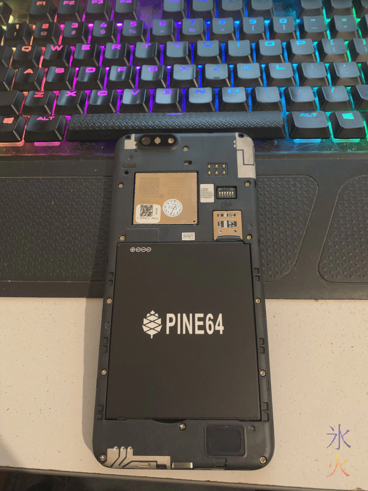 PinePhone Pro with back cover off showing the easy to see internals PinePhone Pro with back cover off showing the easy to see internals