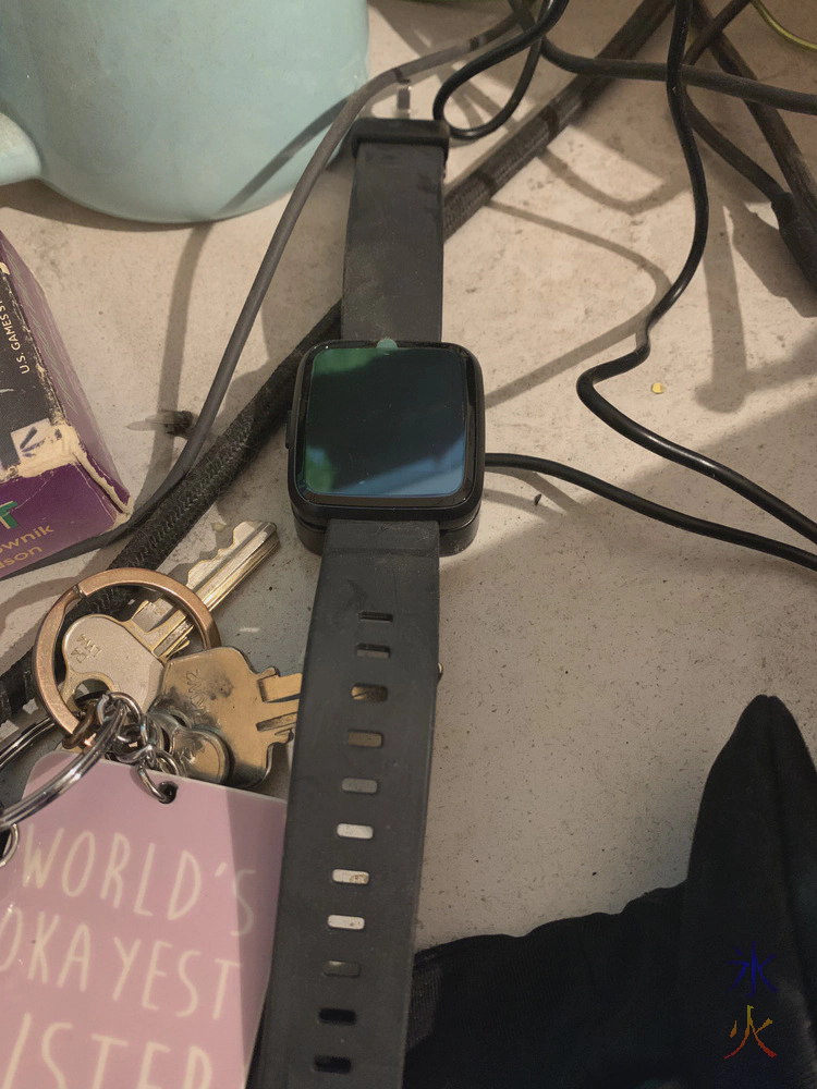Pinetime watch charging on its magnetic charger amongst the mess on the very dusty desk Pinetime watch charging on its magnetic charger amongst the mess on the very dusty desk