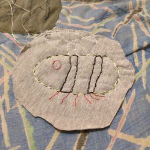 first patch I ever made newly stitched onto the first patchwork quilt I ever did