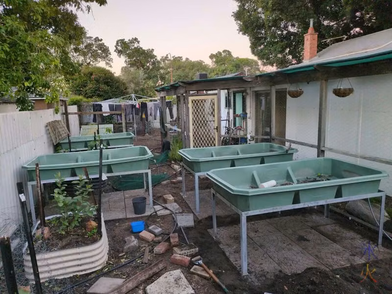 aquaponics grow beds on their new paver bases