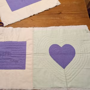 first two quilt blocks stitched together
