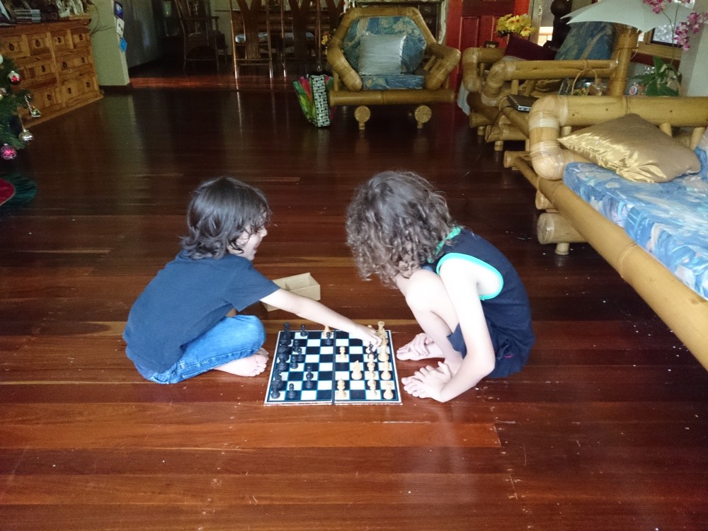10yo and 5yo playing chess