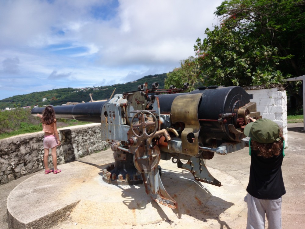 Kids pretending to operate cannon at Tai Jin House, Christmas Island, Australia