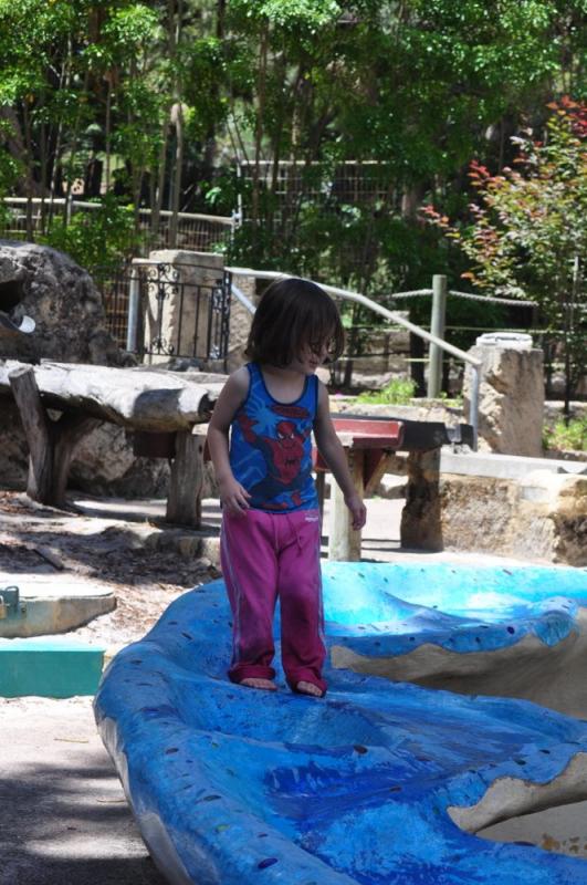 Toddler playing in the water course at Perth Zoo