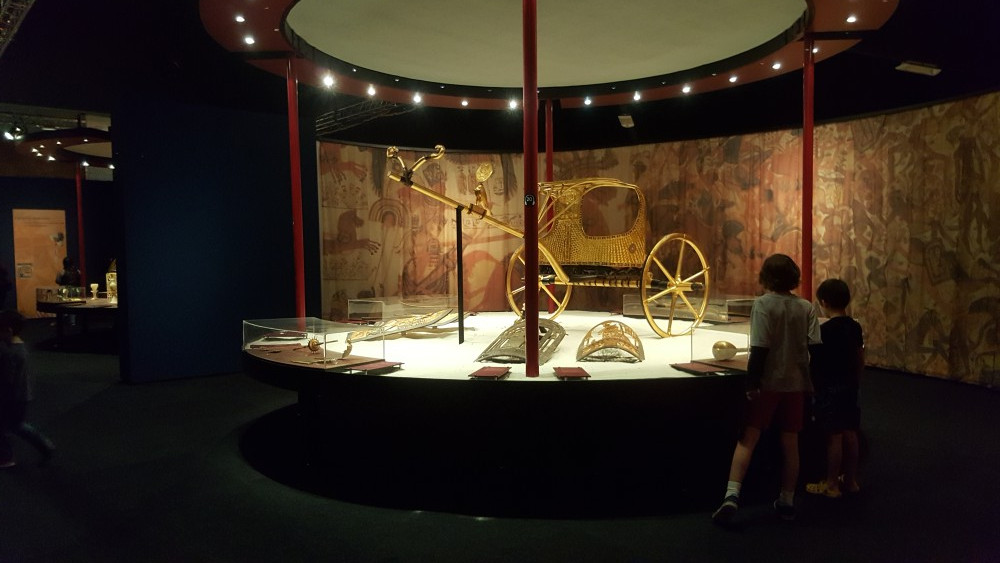 Homeschooled students admiring gold chariot grave good at King Tut exhibition, Perth Convention Centre, Perth, Western Australia