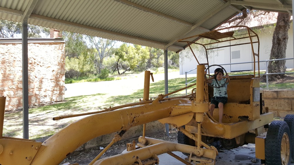 7yo playing on old farm machinery at Azelia Ley Homestead, Hamilton Hill, Western Australia