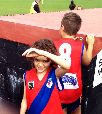9yo in West Perth colours for a little league game at half time during a WAFL game