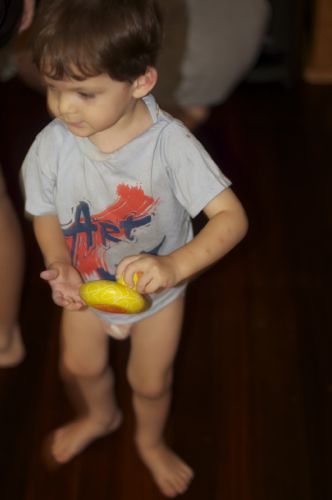 Little Small Boy with a rubber ducky from one of his Christmas presents