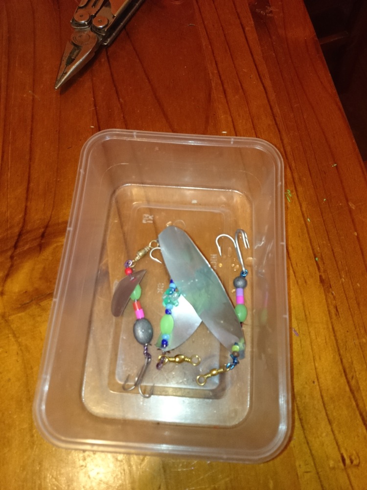 Container of fishing lures, one made by each child