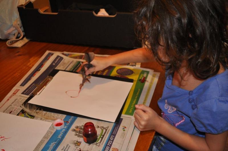 6yo sketching with chicken feather quill and red ink