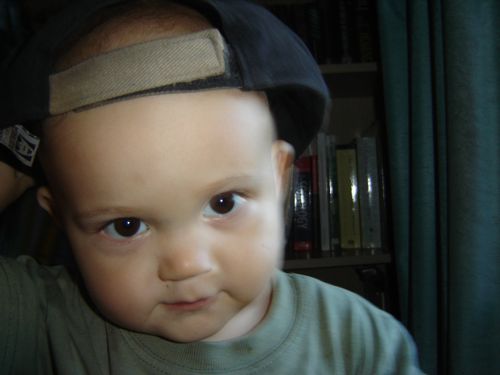 toddler wearing cap backwards