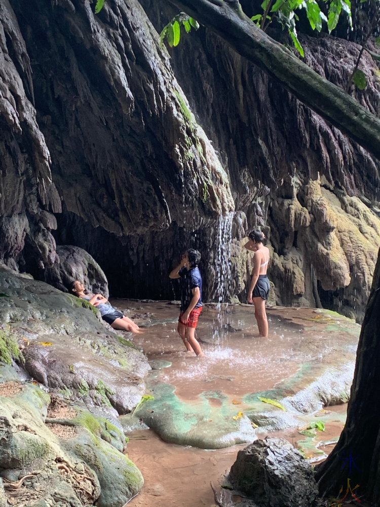 kids cleaning off under waterfall, Hugh's Dale, Christmas Island