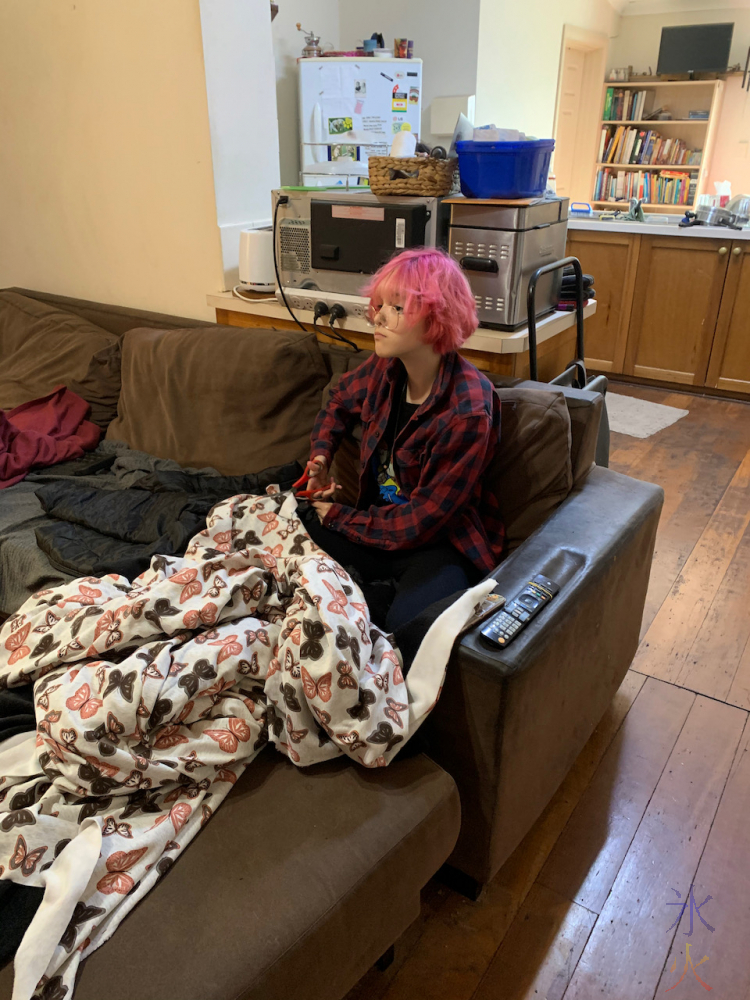 14yo making a tie together blanket while watching tv