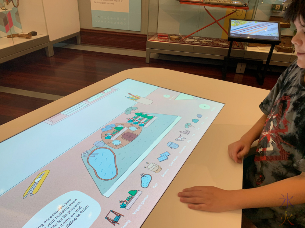 12yo playing with architecture design interactive display at Boola Bardip Museum, Perth, Western Australia