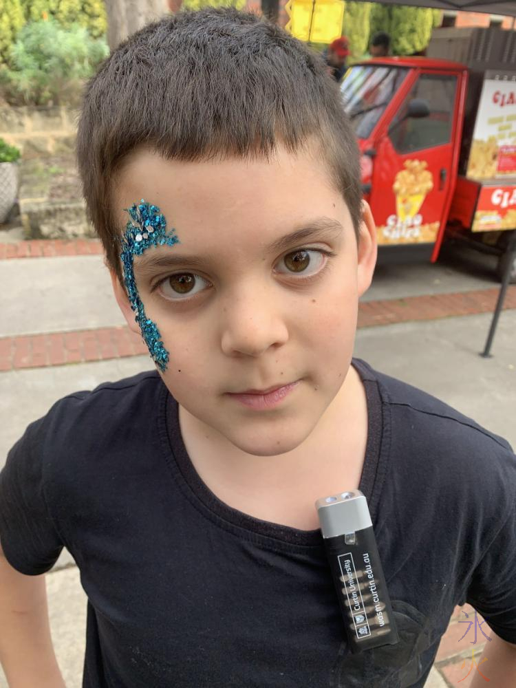 10yo with glitter face paint