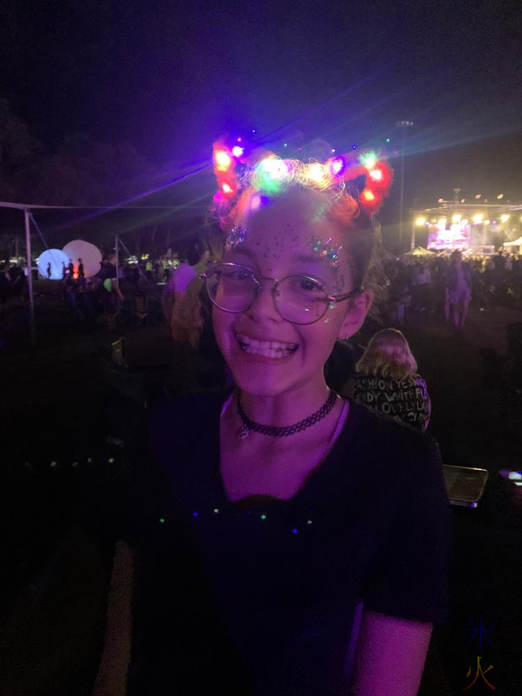 13yo with glitter face paint and light up cat ears at Illuminate